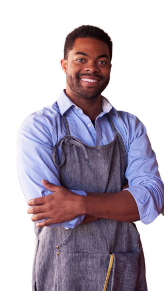 A black shop owner talking to a customer in a store and smiling